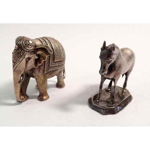 308 - An Indian white metal miniature elephant 6cm tall and a white metal model horse