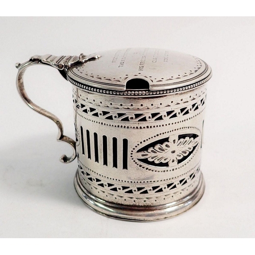 309 - A pierced silver mustard pot engraved presentation with liner, London 1784 by Robert Hennell, 105g