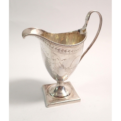 311 - A George III silver helmet form cream jug with floral swag decoration, London 1794, by George Gray, ... 