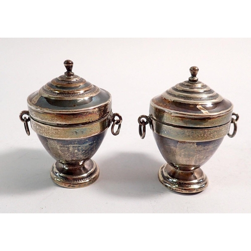 314 - A pair of continental silver miniature urn form boxes, import marks for 1891, by 	Soloman Nathan Nyb... 