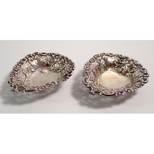 321 - A pair of silver pierced bon bon dishes with embossed decoration, Birmingham 1896, 9 x 8cm, 39.4g