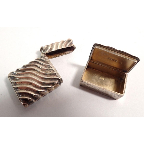 323 - A silver vesta case with diagonal fluting Birmingham 1893 4.3cm tall 21g and a silver pill box Birmi... 