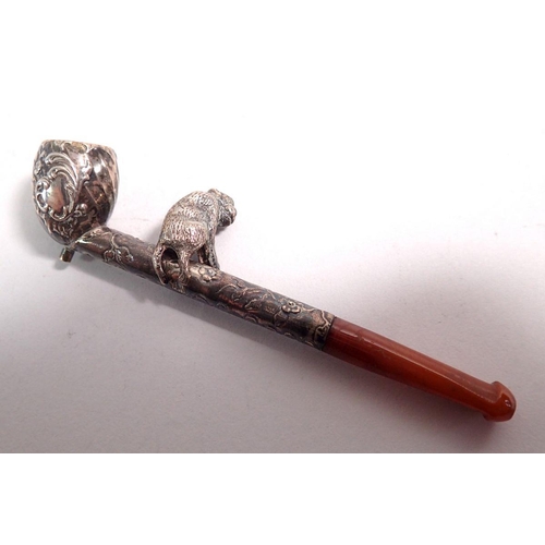 325 - An unusual 19th century miniature white metal pipe with monkey to stem and amber mouthpiece, 7cm