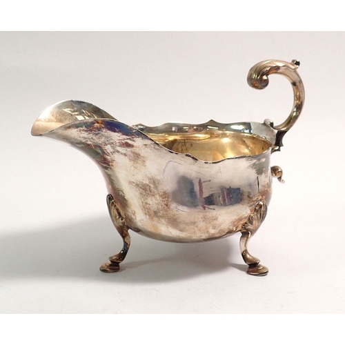 334 - A silver sauce boat on shell and hoof feet, 200g, Sheffield 1897, by Atkin Brothers