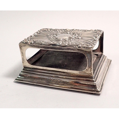 335 - A silver matchbox holder with embossed decoration, 8.5 x 6.5cm, Birmingham 1902