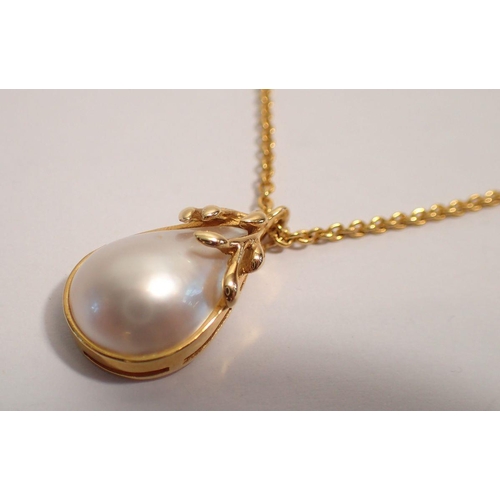 346 - An 18 carat gold and pearl pendant on gold plated chain, 2.6cm drop, pendant 4g