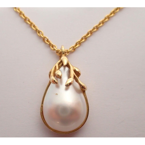 346 - An 18 carat gold and pearl pendant on gold plated chain, 2.6cm drop, pendant 4g