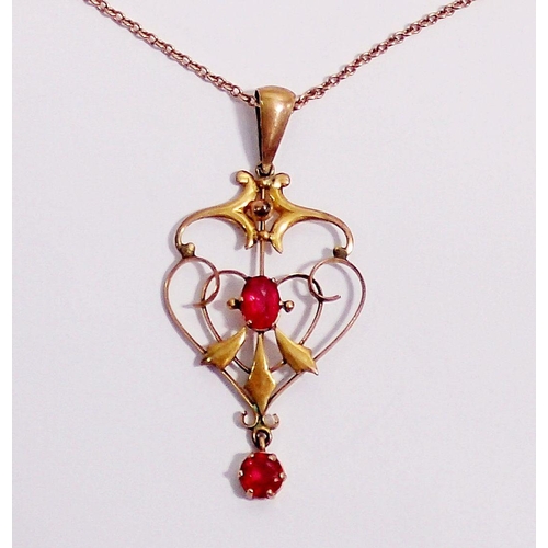 347 - An Edwardian 9 carat gold Art Nouveau pendant necklace set red stones and 9 carat gold chain, 3.8g