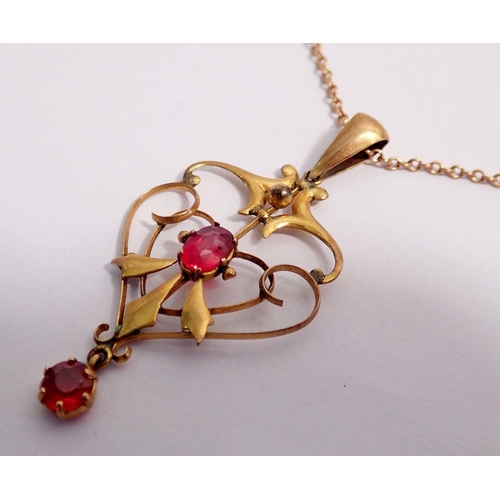 347 - An Edwardian 9 carat gold Art Nouveau pendant necklace set red stones and 9 carat gold chain, 3.8g