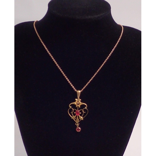 347 - An Edwardian 9 carat gold Art Nouveau pendant necklace set red stones and 9 carat gold chain, 3.8g