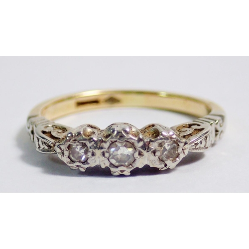 352 - An Edwardian gold ring illusion set three diamonds, size G, 2.5g