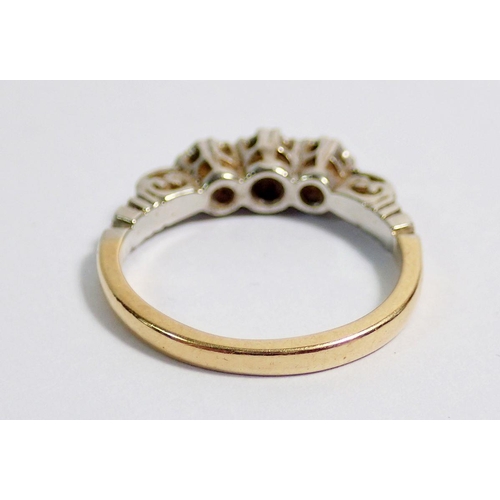 352 - An Edwardian gold ring illusion set three diamonds, size G, 2.5g