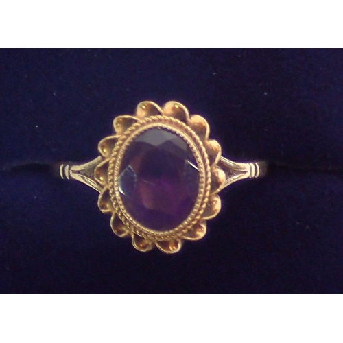 353 - A 9 carat gold oval cut amethyst cluster ring, 1.2 x 1.1cm, size O, 2.6g