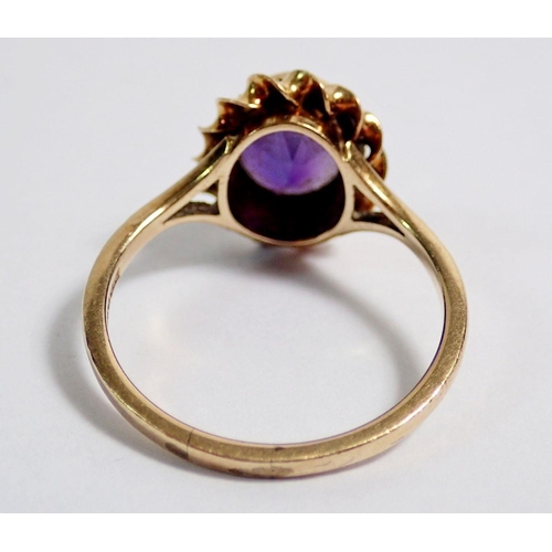 353 - A 9 carat gold oval cut amethyst cluster ring, 1.2 x 1.1cm, size O, 2.6g