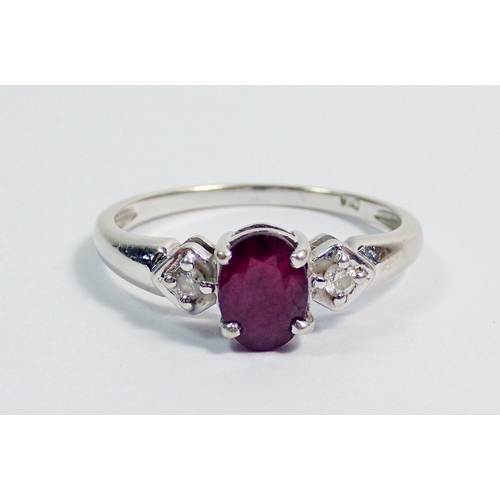 360 - A 9 carat white gold ring set ruby flanked by two diamonds, size O to P, 2.1g