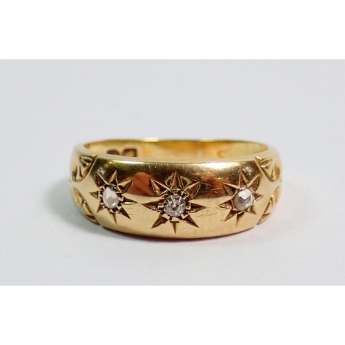 363 - An 18 carat gold gypsy ring set three diamonds, size H, 2.7g