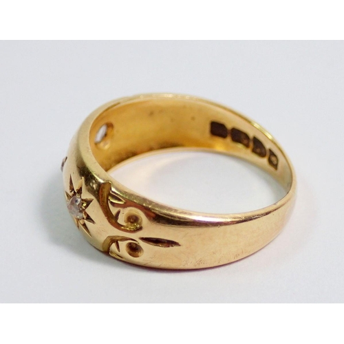 363 - An 18 carat gold gypsy ring set three diamonds, size H, 2.7g