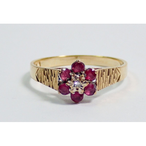 366 - A 9 carat gold ruby and diamond cluster ring, size K, 2.1g