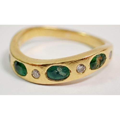 373 - A Portuguese gold ring set three emeralds and four small diamonds on serpentine band, size L (two em... 