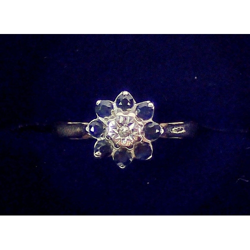 378 - A 9 carat gold sapphire and illusion set diamond cluster ring, size N, 2.5g