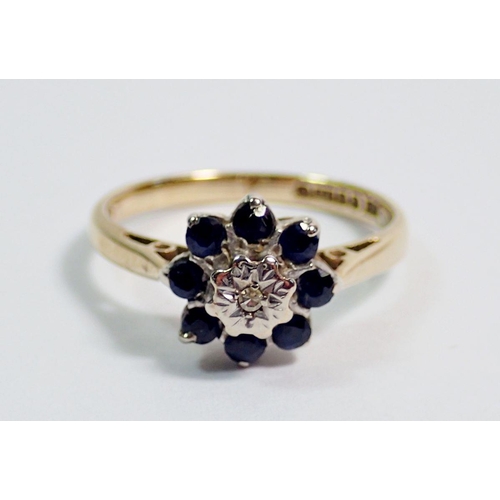 378 - A 9 carat gold sapphire and illusion set diamond cluster ring, size N, 2.5g