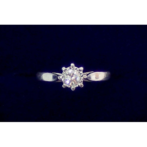 379 - A platinum illusion set solitaire diamond ring, size J, 2.8g