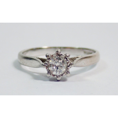 379 - A platinum illusion set solitaire diamond ring, size J, 2.8g