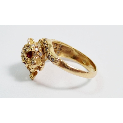 384 - An 18 carat gold diamond set ring in the form of a leopard, with ruby eyes, size K, 5.5g