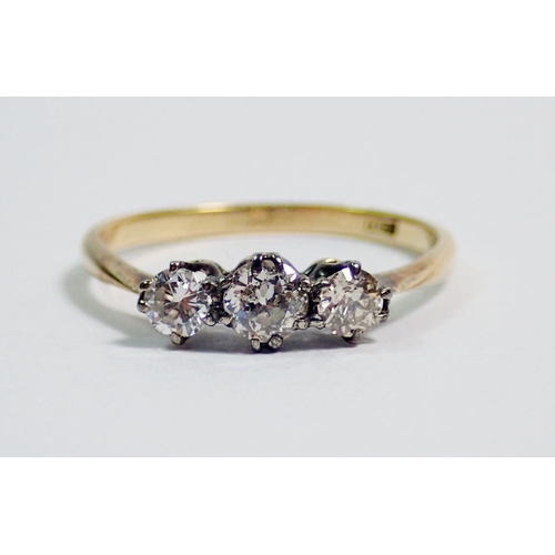 385 - An 18 carat gold three stone diamond ring, size N, 1.5g