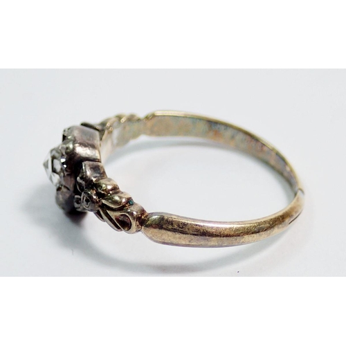 387 - An antique old cut diamond ring set in yellow and white metal, unmarked, repaired in places to shank... 