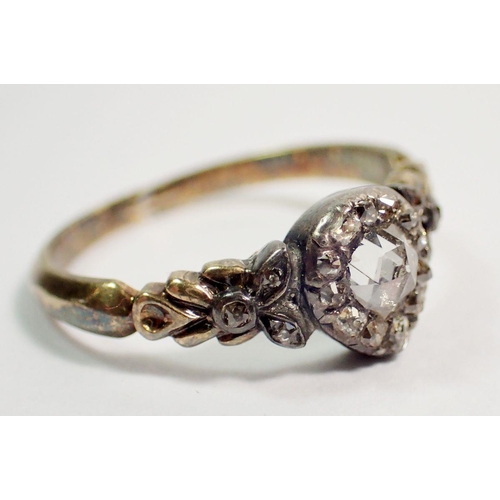 387 - An antique old cut diamond ring set in yellow and white metal, unmarked, repaired in places to shank... 