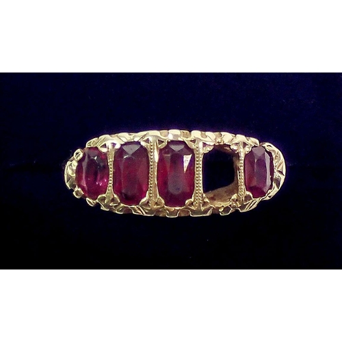 388 - An 18 carat gold ruby ring - one stone deficient, unmarked, size M, largest ruby 6 x 3mm, 4.6g