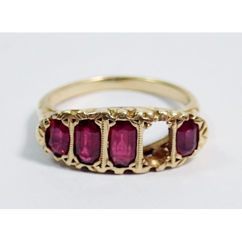 388 - An 18 carat gold ruby ring - one stone deficient, unmarked, size M, largest ruby 6 x 3mm, 4.6g