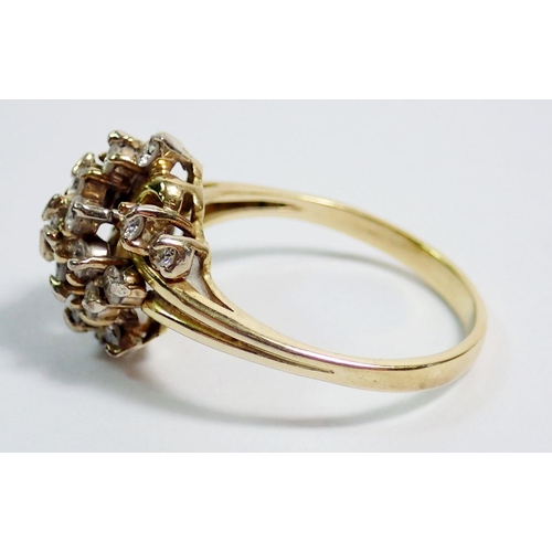 394 - An 18 carat gold ring with twenty one diamonds set in asymmetrical bow design, size T, 5.7g