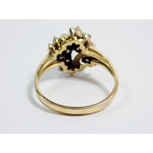 394 - An 18 carat gold ring with twenty one diamonds set in asymmetrical bow design, size T, 5.7g