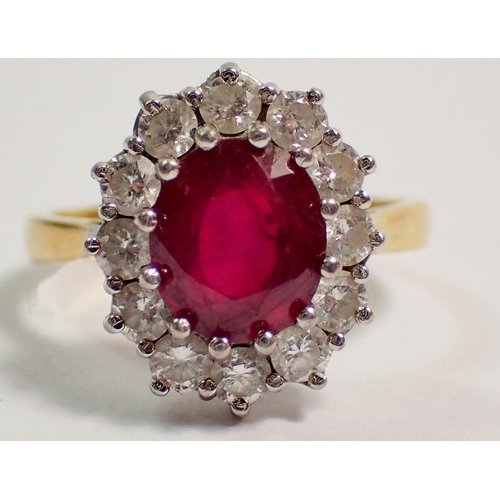 395 - An 18 carat gold ruby and diamond cluster ring, size P, 5.8g, cluster 11mm x 9mm