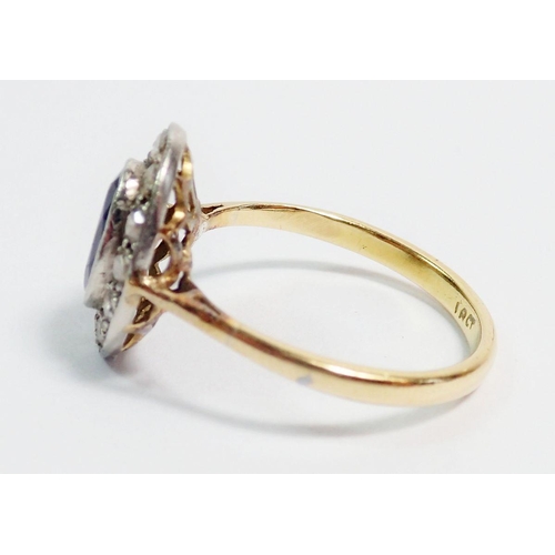 396 - An 18 carat gold sapphire and diamond oval cluster ring, 1.5 x 1.1cm, size P, 3.9g