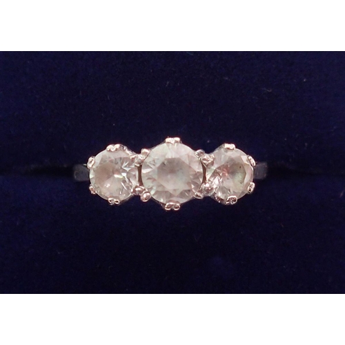 404 - An 18 carat gold ring set three white stones, size L, 3.3g