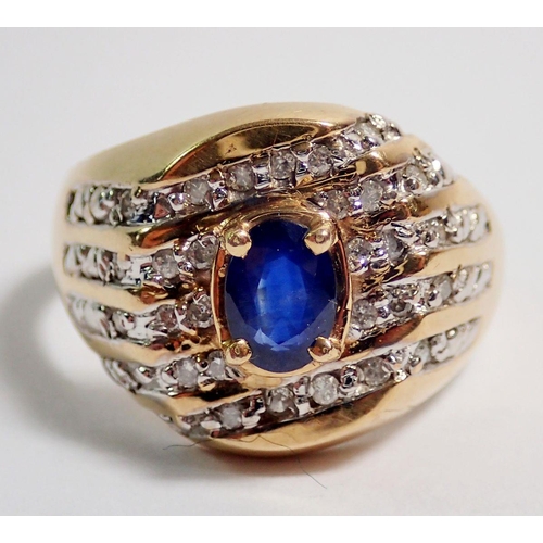 408 - A 10 carat gold ring set oval cut sapphire within diamond diagonal set surround, size W, 6g