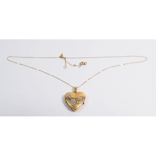 421 - A 9 carat gold heart form locket decorated flowers on fine 9 carat gold chain, 2g