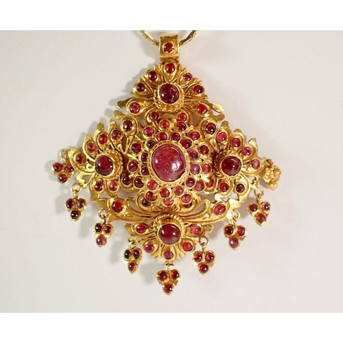 443 - An Indian high grade gold square openwork pendant set multiple cabochon rubies with cabochon ruby dr... 