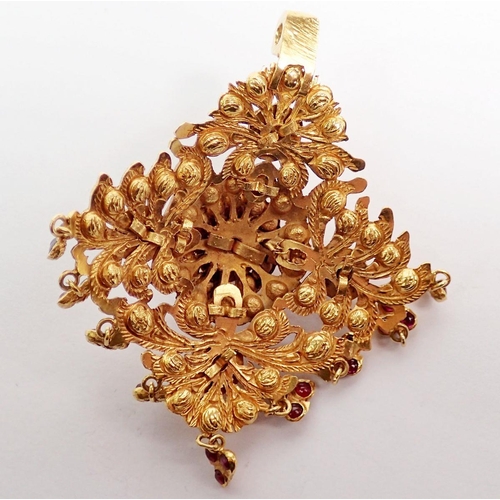 443 - An Indian high grade gold square openwork pendant set multiple cabochon rubies with cabochon ruby dr... 