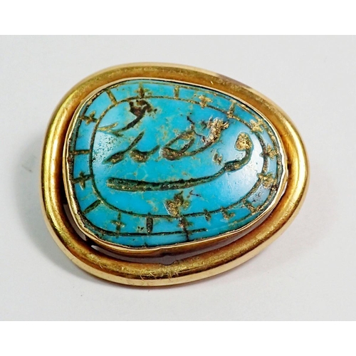 444 - A Persian inscribed turquoise brooch set in gold mount, 2.5 x 2.1cm, 6.3g, unmarked but tested as at... 