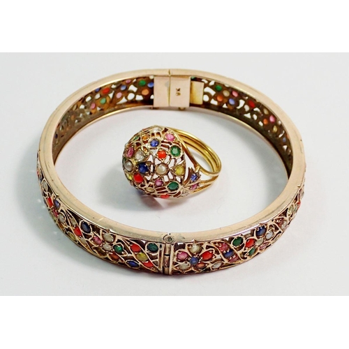 448 - A 9 carat gold Eastern bangle and ring inset semi-precious stones and seed pearls, 27g