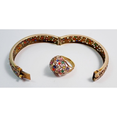 448 - A 9 carat gold Eastern bangle and ring inset semi-precious stones and seed pearls, 27g