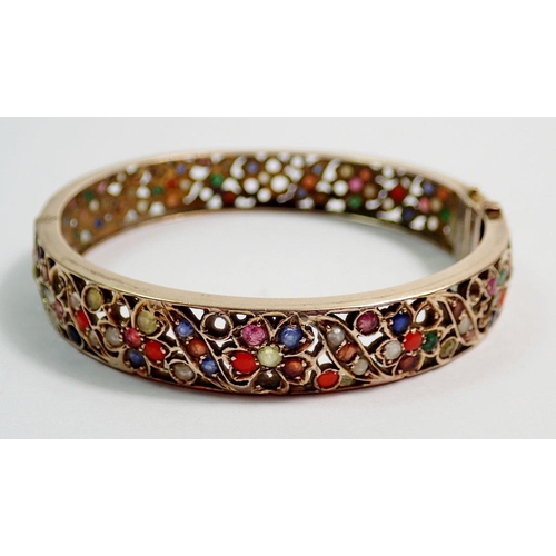 448 - A 9 carat gold Eastern bangle and ring inset semi-precious stones and seed pearls, 27g