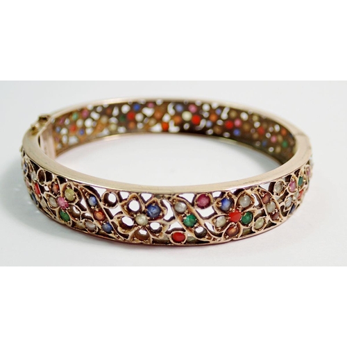 448 - A 9 carat gold Eastern bangle and ring inset semi-precious stones and seed pearls, 27g