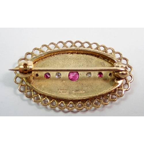 450 - A 9 carat gold oval brooch set rubies and diamonds, 3.2 x 1.8cm, 5.3g