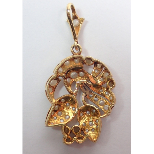 460 - An Edwardian gold and seed pearl pendant in the form of a floral spray, 5cm drop, 6.4g