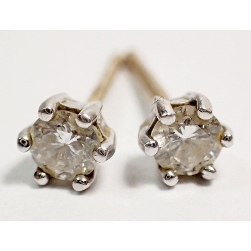 462 - A pair of 9 carat gold diamond stud earrings